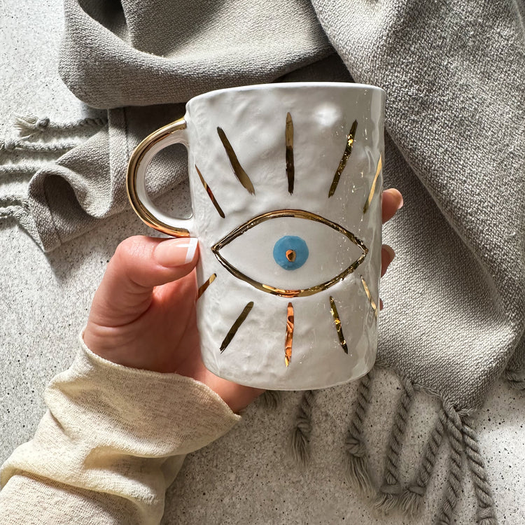 Zeep Naturals | White Ceramic Coffee/Tea Cup | Charming Eye | Zeep Naturals brings you handcrafted soaps, organic cotton towels, and artisan kitchen essentials — all inspired by nature. Discover simple, sustainable living with products designed to soothe your senses and your home.