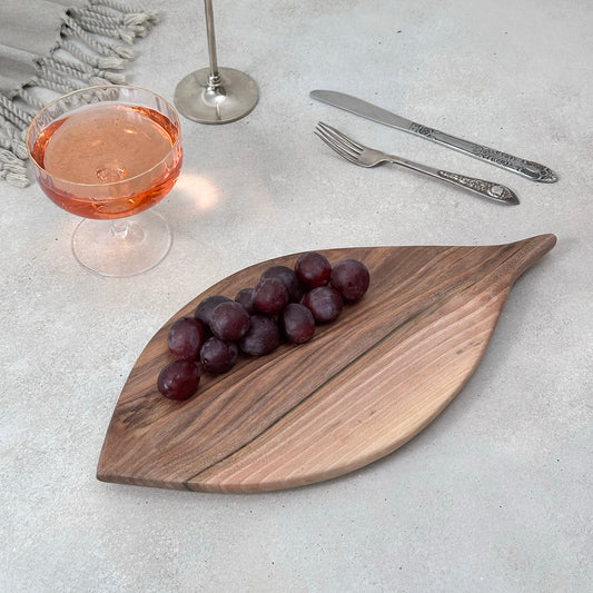 Zeep Naturals | Carya Collection Leaf-Shaped Walnut Curved Serving & Presentation Board | Zeep Naturals brings you handcrafted soaps, organic cotton towels, and artisan kitchen essentials — all inspired by nature. Discover simple, sustainable living with products designed to soothe your senses and your home.