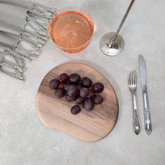 Zeep Naturals | Carya Collection Amorphous Walnut Curved Serving & Presentation Board | Zeep Naturals brings you handcrafted soaps, organic cotton towels, and artisan kitchen essentials — all inspired by nature. Discover simple, sustainable living with products designed to soothe your senses and your home.