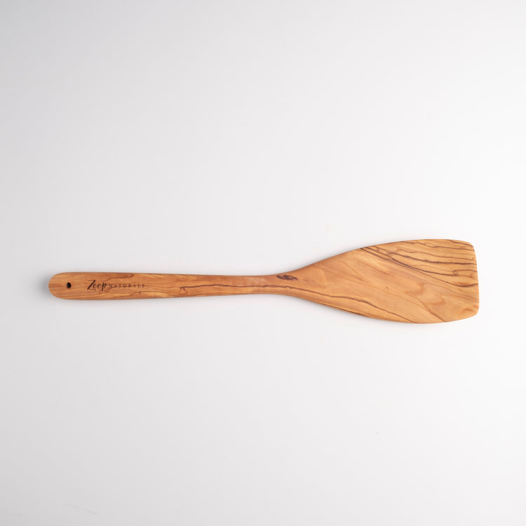 Zeep Naturals | Olive Wood Curve Spatula | Zeep Naturals brings you handcrafted soaps, organic cotton towels, and artisan kitchen essentials — all inspired by nature. Discover simple, sustainable living with products designed to soothe your senses and your home.