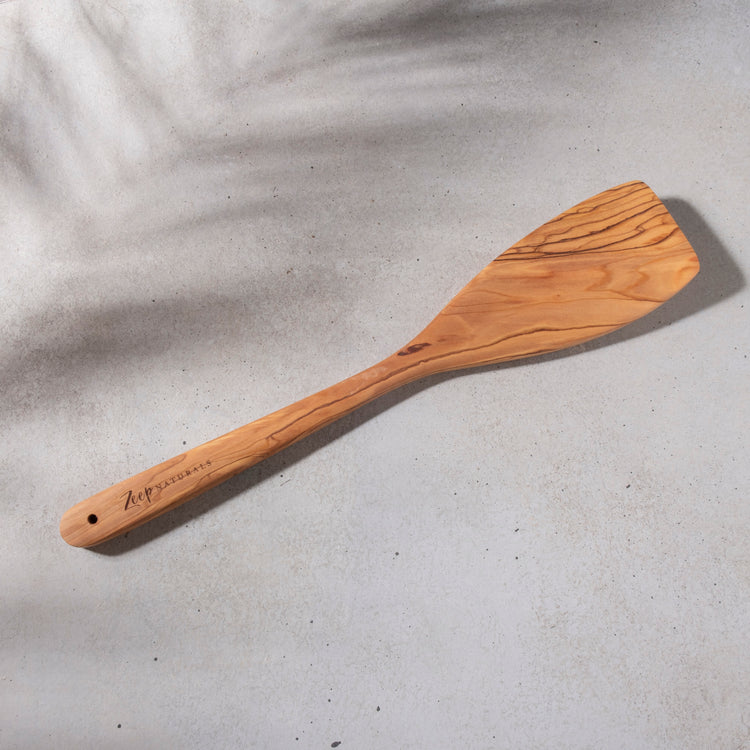 Zeep Naturals | Olive Wood Curve Spatula | Zeep Naturals brings you handcrafted soaps, organic cotton towels, and artisan kitchen essentials — all inspired by nature. Discover simple, sustainable living with products designed to soothe your senses and your home.