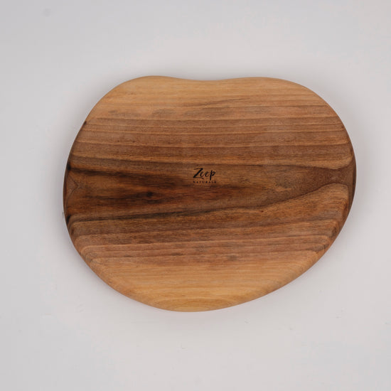 Zeep Naturals | Carya Collection Amorphous Walnut Curved Serving & Presentation Board | Zeep Naturals brings you handcrafted soaps, organic cotton towels, and artisan kitchen essentials — all inspired by nature. Discover simple, sustainable living with products designed to soothe your senses and your home.