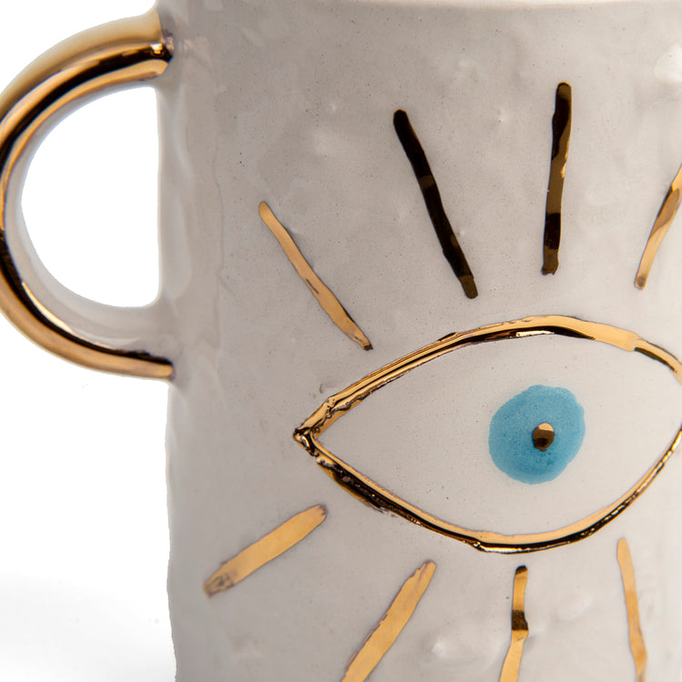 Zeep Naturals | White Ceramic Coffee/Tea Cup | Charming Eye | Zeep Naturals brings you handcrafted soaps, organic cotton towels, and artisan kitchen essentials — all inspired by nature. Discover simple, sustainable living with products designed to soothe your senses and your home.