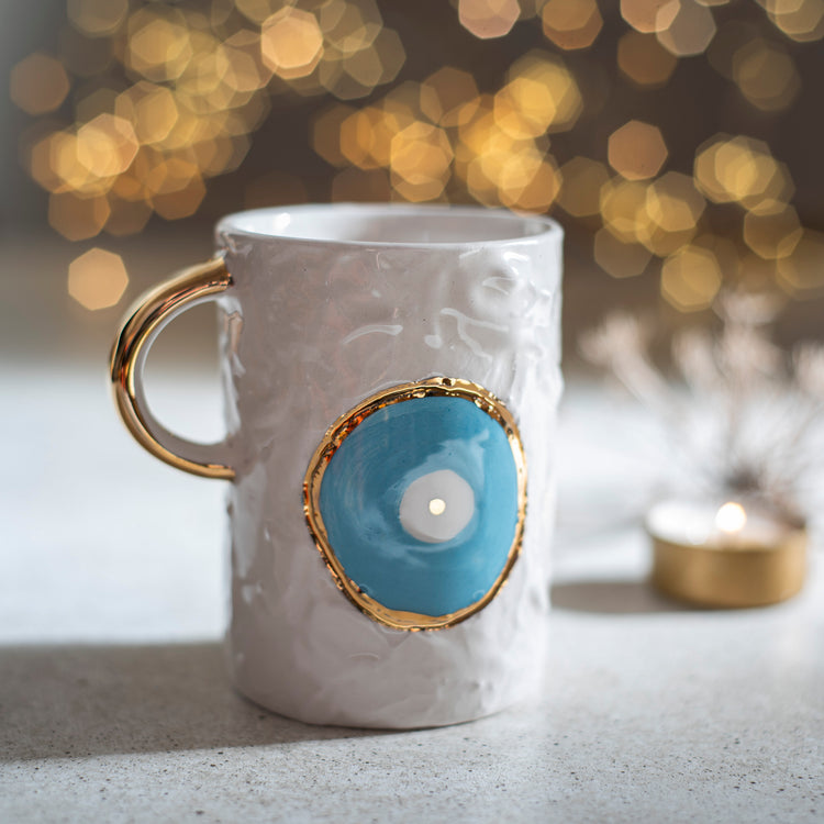 Zeep Naturals | White Ceramic Coffee/Tea Cup | Eternal Eye | Zeep Naturals brings you handcrafted soaps, organic cotton towels, and artisan kitchen essentials — all inspired by nature. Discover simple, sustainable living with products designed to soothe your senses and your home.