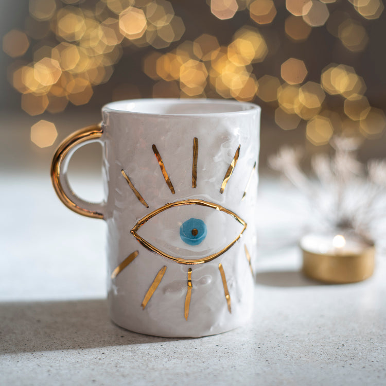 Zeep Naturals | White Ceramic Coffee/Tea Cup | Charming Eye | Zeep Naturals brings you handcrafted soaps, organic cotton towels, and artisan kitchen essentials — all inspired by nature. Discover simple, sustainable living with products designed to soothe your senses and your home.