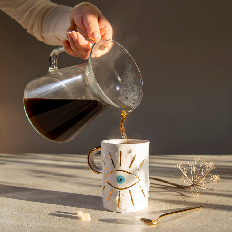 Zeep Naturals | White Ceramic Coffee/Tea Cup | Charming Eye | Zeep Naturals brings you handcrafted soaps, organic cotton towels, and artisan kitchen essentials — all inspired by nature. Discover simple, sustainable living with products designed to soothe your senses and your home.