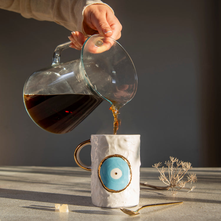 Zeep Naturals | White Ceramic Coffee/Tea Cup | Eternal Eye | Zeep Naturals brings you handcrafted soaps, organic cotton towels, and artisan kitchen essentials — all inspired by nature. Discover simple, sustainable living with products designed to soothe your senses and your home.