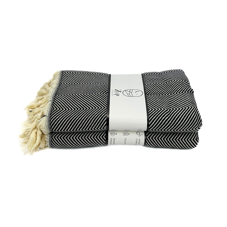 Zeep Naturals | Black Towels Herringbone | Catskills-inspired artisan natural soaps, luxurious Turkish towels, bathrobes, throws, and bedding. Discover handmade coffee cups, milk dispensers, and olive wood kitchen utensils—crafted with care for your home