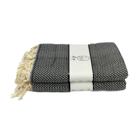 Zeep Naturals | Black Towels Zebra | Catskills-inspired artisan natural soaps, luxurious Turkish towels, bathrobes, throws, and bedding. Discover handmade coffee cups, milk dispensers, and olive wood kitchen utensils—crafted with care for your home