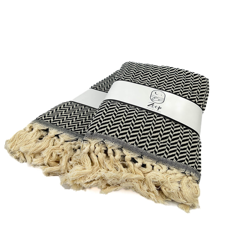 Zeep Naturals | Black Towels Zig-Zag | Catskills-inspired artisan natural soaps, luxurious Turkish towels, bathrobes, throws, and bedding. Discover handmade coffee cups, milk dispensers, and olive wood kitchen utensils—crafted with care for your home