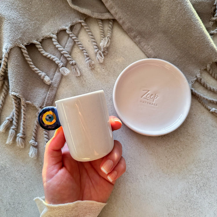 Zeep Naturals | Ceramic Handmade 2-Piece Slim Espresso Cups Evil Eye Handle | Catskills-inspired artisan natural soaps, luxurious Turkish towels, bathrobes, throws, and bedding. Discover handmade coffee cups, milk dispensers, and olive wood kitchen utensils—crafted with care for your home