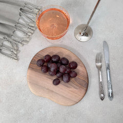 Zeep Naturals | Carya Collection Amorphous Walnut Curved Serving & Presentation Board | Zeep Naturals brings you handcrafted soaps, organic cotton towels, and artisan kitchen essentials — all inspired by nature. Discover simple, sustainable living with products designed to soothe your senses and your home.