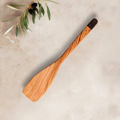 Zeep Naturals | Olive Wood Ember Grain Curve Spatula | Zeep Naturals brings you handcrafted soaps, organic cotton towels, and artisan kitchen essentials — all inspired by nature. Discover simple, sustainable living with products designed to soothe your senses and your home.