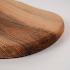 Zeep Naturals | Carya Collection Amorphous Walnut Curved Serving & Presentation Board | Zeep Naturals brings you handcrafted soaps, organic cotton towels, and artisan kitchen essentials — all inspired by nature. Discover simple, sustainable living with products designed to soothe your senses and your home.