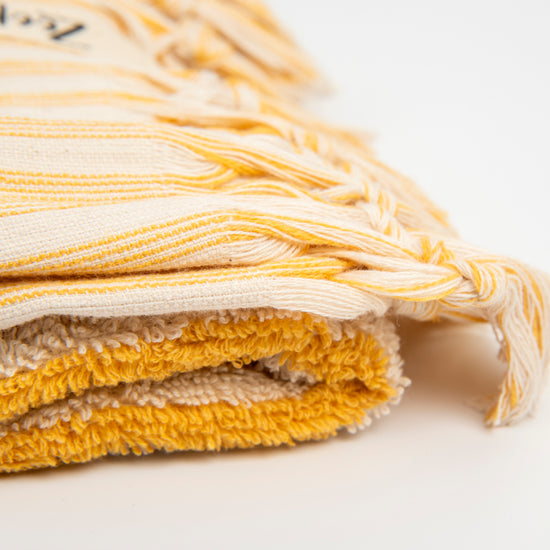 Zeep Naturals | Striped Towels Goldenrod Hand | Catskills-inspired artisan natural soaps, luxurious Turkish towels, bathrobes, throws, and bedding. Discover handmade coffee cups, milk dispensers, and olive wood kitchen utensils—crafted with care for your home