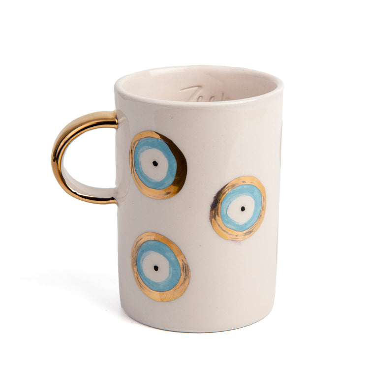 Zeep Naturals | White Ceramic Evil Eye Coffee/Tea Cups | Catskills-inspired artisan natural soaps, luxurious Turkish towels, bathrobes, throws, and bedding. Discover handmade coffee cups, milk dispensers, and olive wood kitchen utensils—crafted with care for your home