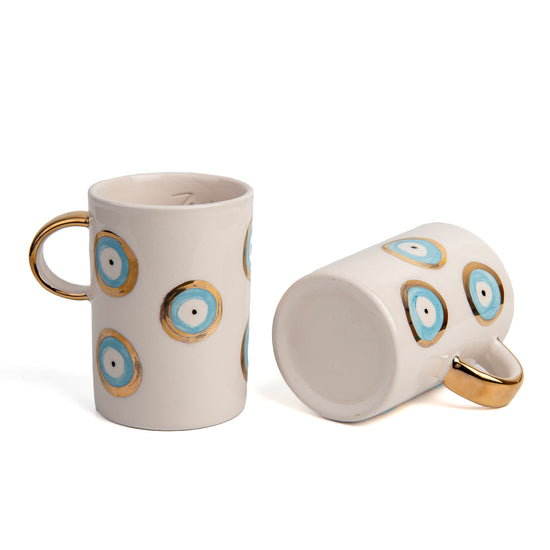 Zeep Naturals | White Ceramic Evil Eye Coffee/Tea Cups | Catskills-inspired artisan natural soaps, luxurious Turkish towels, bathrobes, throws, and bedding. Discover handmade coffee cups, milk dispensers, and olive wood kitchen utensils—crafted with care for your home