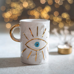 Zeep Naturals | White Ceramic Coffee/Tea Cup | Charming Eye | Zeep Naturals brings you handcrafted soaps, organic cotton towels, and artisan kitchen essentials — all inspired by nature. Discover simple, sustainable living with products designed to soothe your senses and your home.